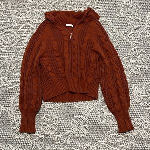 Grey Bandit burnt orange sweater